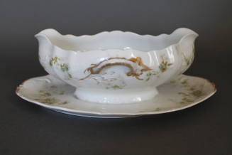 Gravy boat with attached under plate