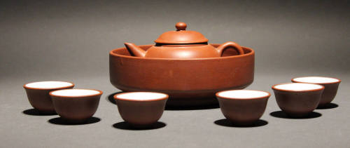Teapot within, bowl and six cups