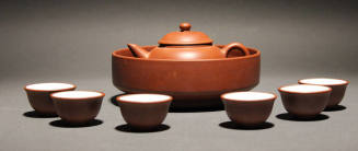 Teapot within, bowl and six cups