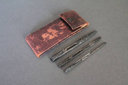 Leather case with silver instruments