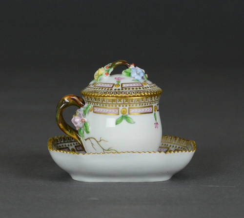 Covered cup with saucer