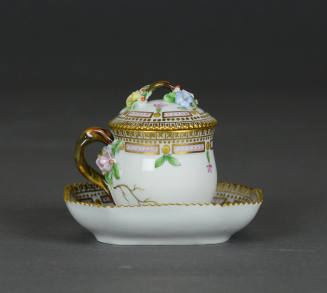 Covered cup with saucer