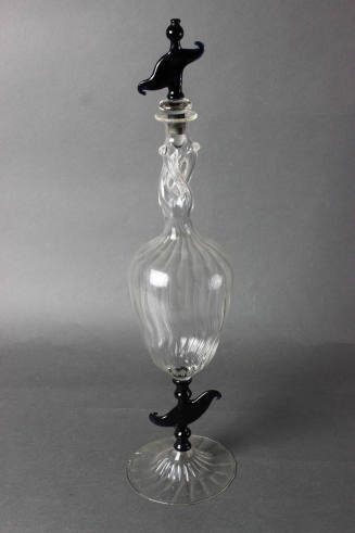 Tall decanter with dark blue stopper