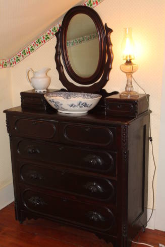 Chest of drawers with attached mirror